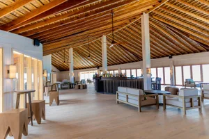 Modern hotel lobby featuring wood materials and minimalistic design elements