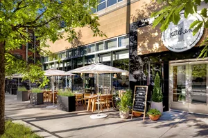 Modern restaurant exterior with concrete and glass materials