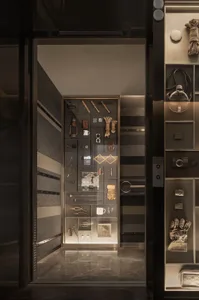 A storefront with an industrial design featuring metal and glass elements.