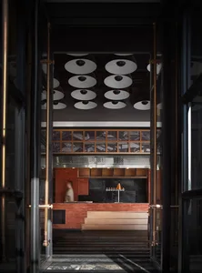 A metallic lobby space with a modern and industrial feel, featuring a bar counter and abstract ceiling lights.