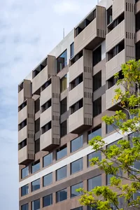 A modern building with aluminum paneling on its exterior.