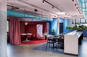 A modern cafe interior with colorful furniture and decor.