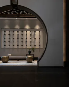A modern lobby featuring metal and concrete elements.