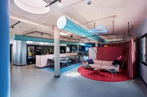Modern office interior with metal, glass, and concrete materials.