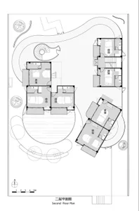 Floor plan of a residential building with multiple rooms and a central staircase.