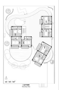 A detailed architectural drawing of a three-story residential building, including floor plans and outdoor landscaping.