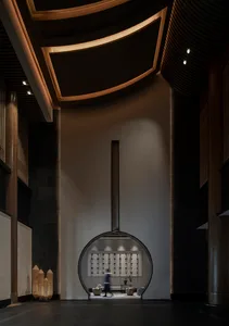 A modern lobby features concrete and wooden materials with curved ceiling and circular entrance.