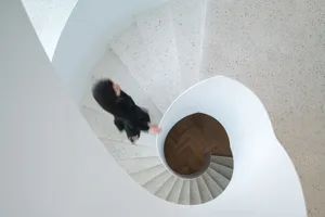 A modern spiral staircase made of concrete.