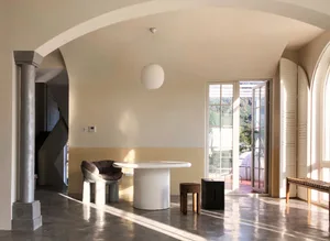 Modern living room with concrete floor and minimalist design