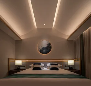 Modern bedroom featuring plush textiles, fabric curtains, and a wooden frame.