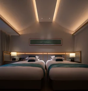 A modern minimalist bedroom featuring fabric and wood elements, with two twin beds, a headboard, and a light fixture.
