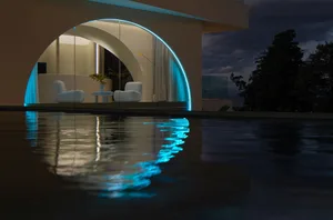 A minimalist residential interior featuring modern glass elements.