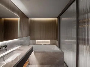 Modern bathroom with concrete walls and glass shower enclosure