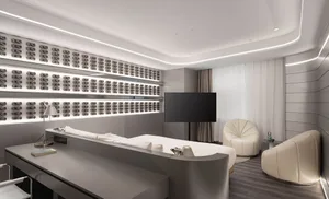 A sleek, modern hotel room featuring metallic finishes and a minimalist design.