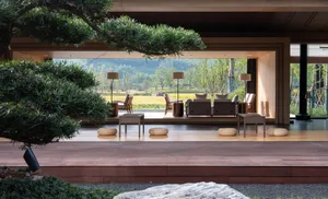 Modern living room featuring wooden and stone materials with a black floor.