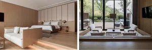 Modern minimalist living room with white furniture and wooden walls and floor.