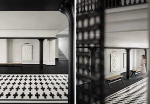 An entrance hallway featuring modern design with concrete floor tiles in black and white color scheme.