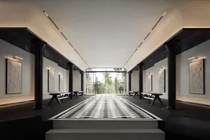 Modern hotel lobby with concrete flooring and minimalist design.