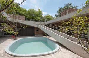 Concrete and glass modern poolside structure