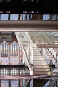 Modern staircase made of glass and marble materials.