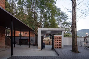 Concrete minimalist architectural space featuring natural surroundings and simple design