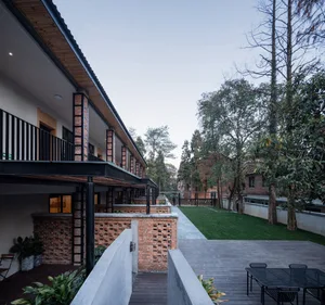 Modern residential exterior featuring brick and wood materials.