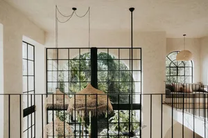 Industrial-style interior with metal, glass, and wicker accents