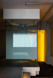 Minimalist bathroom featuring tiled glass walls