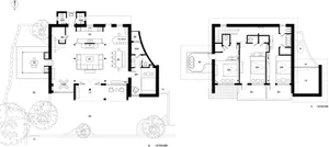 A modern house floor plan on paper depicting various rooms and spaces.