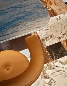 An elegant marble table with a matching marble floor.