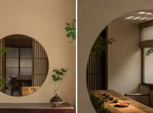 Minimalist interior design featuring wooden furnishings and concrete planters in a coffee shop