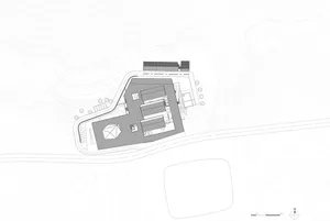 An overhead view of a modern office layout with open-plan workstations, meeting rooms, and open areas.