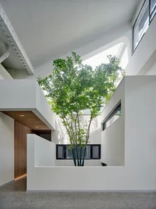Modern interior space featuring concrete and glass materials.