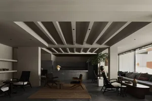 A modern interior living room with concrete walls and minimalist furniture.