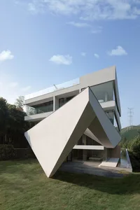 A modern residential concrete house with an unique angular design.