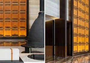 View of a modern lobby featuring metal cabinets with black handles.
