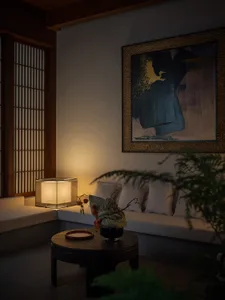 A cozy living room featuring neutral-tones furniture and a modern abstract painting.