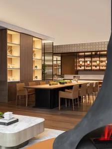 Modern dining room featuring wooden furniture and contemporary design elements.