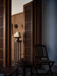 A modern interior space featuring wooden furniture and decor.