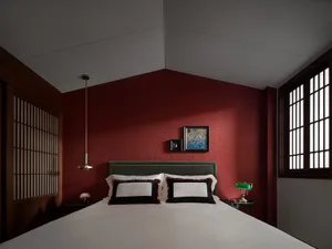A modern bedroom featuring metallic accents, fabric textiles, and wooden furniture.