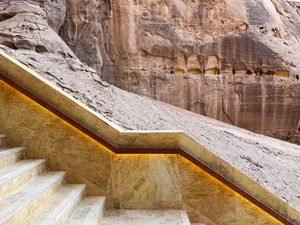 A staircase made of marble surrounded by natural rock formations.