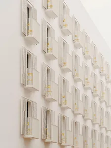 Multiple windows with white shutters in an urban residential building.