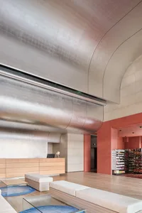 Modern retail storefront featuring sleek glass and concrete materials.