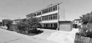 Modern building facade with large glass windows and concrete material