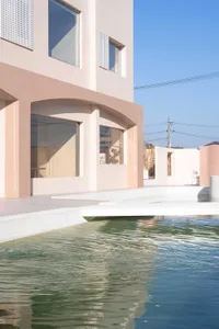 Concrete exterior of a modern house with a pool