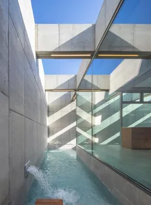 Modern interior design featuring concrete and glass materials