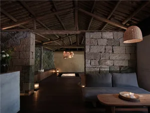 Modern living room with stone and concrete elements