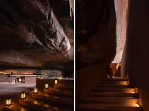 Stone spa interior with lanterns and steps leading downward.
