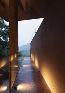 A modern balcony with granite floor and integrated lighting.