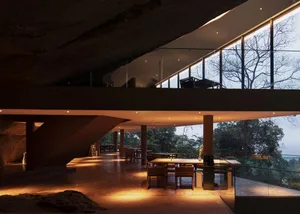 A modern restaurant interior with a concrete floor and open design.